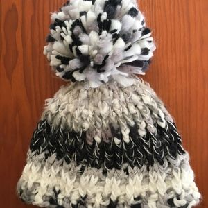 Knitted hat with pom pom